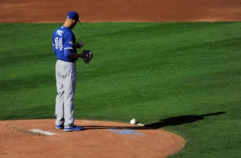 KANSAS CITY, MO – OCTOBER 17: David Price #14 of the Toronto Blue Jays looks at the ball in the first inning against the Kansas City Royals during game two of the American League Championship Series at Kauffman Stadium on October 17, 2015 in Kansas City, Missouri. (Photo by Ed Zurga/Getty Images)