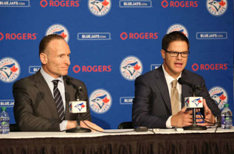 TORONTO, CANADA – DECEMBER 4: President Mark Shapiro looks on as Ross Atkins speaks to the media as Atkins is introduced as the new general manager of the Toronto Blue Jays during a press conference on December 4, 2015 at Rogers Centre in Toronto, Ontario, Canada. (Photo by Tom Szczerbowski/Getty Images)