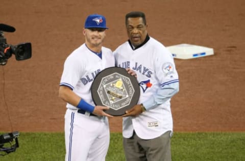 TORONTO, CANADA – APRIL 8: Josh Donaldson #20 of the Toronto Blue Jays is presented with the 2015 A.L. MVP Award by former player and only Blue Jays player to ever win an MVP George Bell before the start of MLB game action against the Boston Red Sox on April 8, 2016 at Rogers Centre in Toronto, Ontario, Canada. (Photo by Tom Szczerbowski/Getty Images)