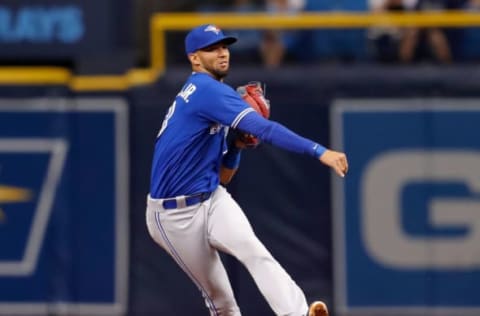 ST. PETERSBURG, FL – MAY 4: Lourdes Gurriel #13 of the Toronto Blue Jays throws out Adeiny Hechavarria #11 of the Tampa Bay Rays in the second inning of a baseball game at Tropicana Field on May 4, 2018 in St. Petersburg, Florida. (Photo by Mike Carlson/Getty Images)