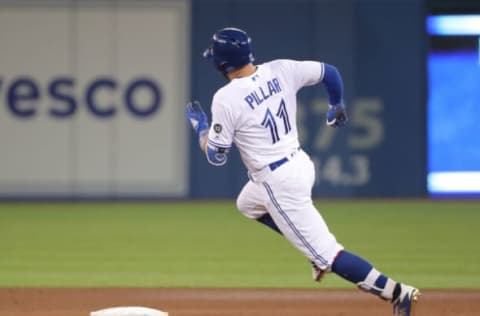 TORONTO, ON – MAY 11: Kevin Pillar #11 of the Toronto Blue Jays races around second base on his way to third base before being thrown out while attempting to stretch a double into a triple in the ninth inning during MLB game action against the Boston Red Sox at Rogers Centre on May 11, 2018 in Toronto, Canada. (Photo by Tom Szczerbowski/Getty Images) *** Local Caption *** Kevin Pillar