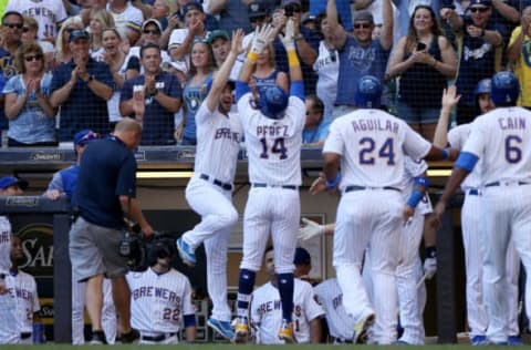 MILWAUKEE, WI – JULY 08: Hernan Perez #14 of the Milwaukee Brewers celebrates with teammates after hitting a home run in the third inning against the Atlanta Braves at Miller Park on July 8, 2018 in Milwaukee, Wisconsin. (Photo by Dylan Buell/Getty Images)