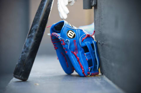 CLEVELAND, OH – APRIL 07: The bat and glove of Jose Bautista