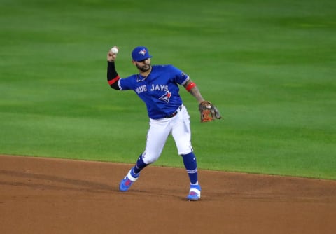 BUFFALO, NY – SEPTEMBER 24: Jonathan Villar #20 of the Toronto Blue Jays fields the ball and makes the throw to first base fo an out during the sixth inning against the New York Yankees at Sahlen Field on September 24, 2020 in Buffalo, New York. The Blue Jays are the home team due to the Canadian government’s policy on COVID-19, which prevents them from playing in their home stadium in Canada. (Photo by Timothy T Ludwig/Getty Images)