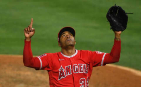 ANAHEIM, CA – JUNE 04: Raisel Iglesias #32 of the Los Angeles Angels celebrates after pitching out of a bases loaded, no outs jam in the eighth inning of the game against the Seattle Mariners at Angel Stadium of Anaheim on June 4, 2021 in Anaheim, California. (Photo by Jayne Kamin-Oncea/Getty Images)