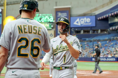 ST. PETERSBURG, FL – APRIL 14: Kevin Smith #1 of the Oakland Athletics celebrates scoring with Sheldon Neuse #26 against the Tampa Bay Rays in the fourth inning of a baseball game at Tropicana Field on April 14, 2022 in St. Petersburg, Florida. (Photo by Mike Carlson/Getty Images)