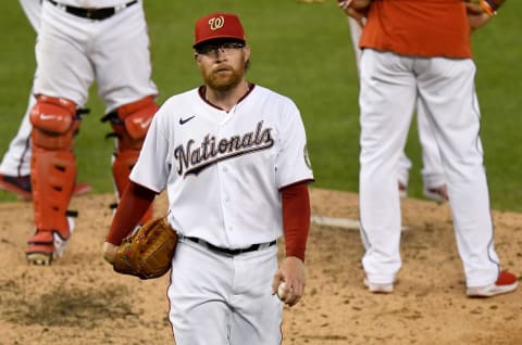 WASHINGTON, DC – AUGUST 05: Sean Doolittle #63 of the Washington Nationals walks to the dugout after being taken out of the game against the New York Mets in the seventh inning at Nationals Park on August 5, 2020 in Washington, DC. (Photo by G Fiume/Getty Images)