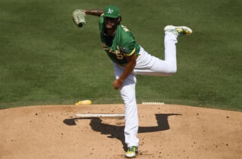 LOS ANGELES, CALIFORNIA – OCTOBER 06: Sean Manaea #55 of the Oakland Athletics pitches against the Houston Astros during the first inning in Game Two of the American League Division Series at Dodger Stadium on October 06, 2020 in Los Angeles, California. (Photo by Kevork Djansezian/Getty Images)