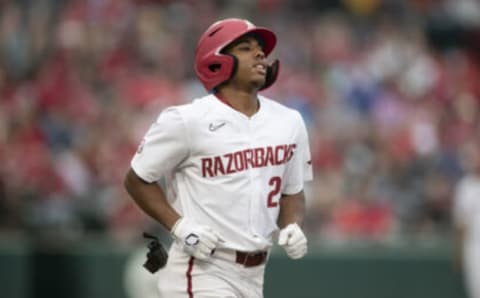 FAYETTEVILLE, ARKANSAS – MAY 20: Christian Franklin #25 of the Arkansas Razorbacks runs to first base after a walk during a game against the Florida Gators at Baum-Walker Stadium at George Cole Field on May 20, 2021 in Fayetteville, Arkansas. The Razorbacks defeated the Gators 6-1. (Photo by Wesley Hitt/Getty Images)