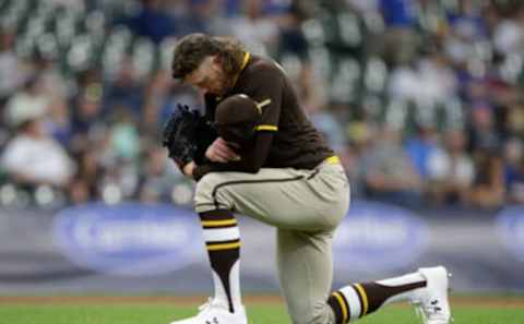 MILWAUKEE, WISCONSIN – MAY 26: Chris Paddack #59 of the San Diego Padres kneels before taking the mound in the first inning against the Milwaukee Brewers at American Family Field on May 26, 2021 in Milwaukee, Wisconsin. (Photo by John Fisher/Getty Images)