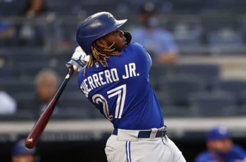 NEW YORK, NY – MAY 25: Vladimir Guerrero Jr. #27 of the Toronto Blue Jays hits a 2-run home run against the New York Yankees during the third inning at Yankee Stadium on May 25, 2021 in the Bronx borough of New York City. (Photo by Adam Hunger/Getty Images)