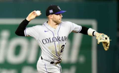 WASHINGTON, DC – SEPTEMBER 17: Trevor Story #27 of the Colorado Rockies throws the ball to first base against the Washington Nationals at Nationals Park on September 17, 2021 in Washington, DC. (Photo by G Fiume/Getty Images)