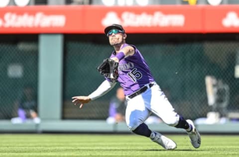 DENVER, CO – APRIL 10: Randal Grichuk #15 of the Colorado Rockies catches a shallow fly ball int he sixth inning of a game against the Los Angeles Dodgers at Coors Field on April 10, 2022 in Denver, Colorado. (Photo by Dustin Bradford/Getty Images)