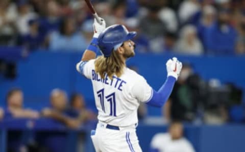 TORONTO, ON – APRIL 09: Bo Bichette #11 of the Toronto Blue Jays hits a game tying solo home run in the fifth inning of their MLB game against the Texas Rangers at Rogers Centre on April 9, 2022 in Toronto, Canada. (Photo by Cole Burston/Getty Images)