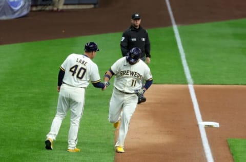 MILWAUKEE, WISCONSIN – APRIL 20: Rowdy Tellez #11 of the Milwaukee Brewers is congratulated by third base Jason Lane #40 following a solo home run against the Pittsburgh Pirates during the second inning at American Family Field on April 20, 2022 in Milwaukee, Wisconsin. (Photo by Stacy Revere/Getty Images)