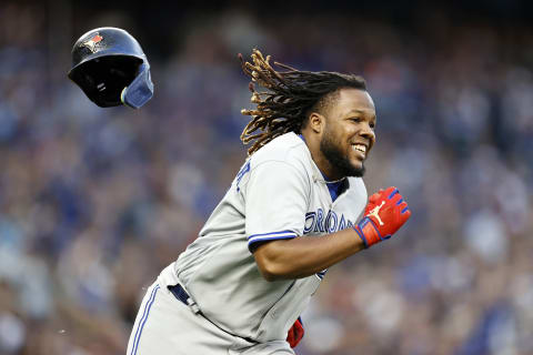 SEATTLE, WASHINGTON – JULY 08: Vladimir Guerrero Jr. #27 of the Toronto Blue Jays loses his helmet as he runs to first base during the fifth inning against the Seattle Mariners at T-Mobile Park on July 08, 2022, in Seattle, Washington. (Photo by Steph Chambers/Getty Images)