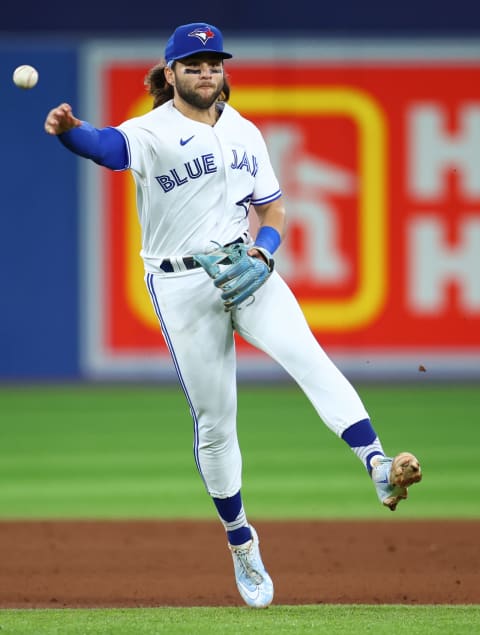 TORONTO, ON – AUGUST 17: Bo Bichette #11 of the Toronto Blue Jays throws to first base against the Baltimore Orioles at Rogers Centre on August 17, 2022, in Toronto, Ontario, Canada. (Photo by Vaughn Ridley/Getty Images)