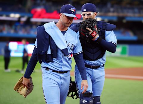 TORONTO, ON – SEPTEMBER 16: Trevor Richards #33 of the Toronto Blue Jays walls to the dugout with catcher Danny Jansen #9 against the Baltimore Orioles at Rogers Centre on September 16, 2022, in Toronto, Ontario, Canada. (Photo by Vaughn Ridley/Getty Images)