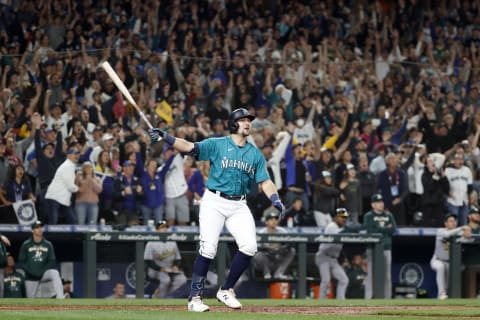 SEATTLE, WASHINGTON – SEPTEMBER 30: Cal Raleigh #29 of the Seattle Mariners celebrates his walk-off home run during the ninth inning against the Oakland Athletics at T-Mobile Park on September 30, 2022 in Seattle, Washington. With the win, the Seattle Mariners have clinched a postseason appearance for the first time in 21 years, the longest playoff drought in North American professional sports. (Photo by Steph Chambers/Getty Images)