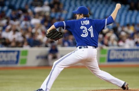 TORONTO, CANADA – SEPTEMBER 30: Brandon Lyon #31 of the Toronto Blue Jays throws a pitch against the New York Yankees during MLB action at the Rogers Centre September 30, 2012 in Toronto, Ontario, Canada. (Photo by Abelimages/Getty Images)