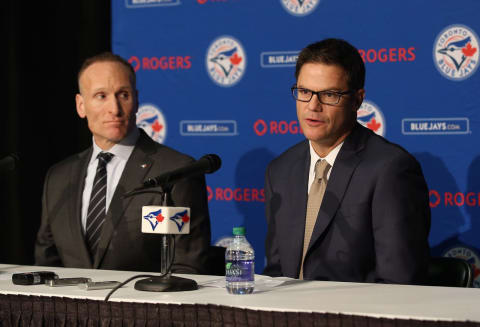 TORONTO, CANADA – DECEMBER 4: President Mark Shapiro looks on as Ross Atkins speaks to the media as Atkins is introduced as the new general manager of the Toronto Blue Jays during a press conference on December 4, 2015 at Rogers Centre in Toronto, Ontario, Canada. (Photo by Tom Szczerbowski/Getty Images)