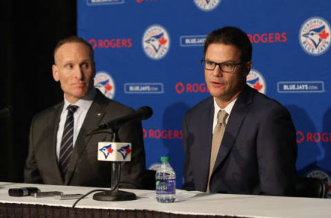 TORONTO, CANADA – DECEMBER 4: President Mark Shapiro looks on as Ross Atkins speaks to the media as Atkins is introduced as the new general manager of the Toronto Blue Jays during a press conference on December 4, 2015 at Rogers Centre in Toronto, Ontario, Canada. (Photo by Tom Szczerbowski/Getty Images)