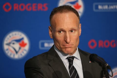 TORONTO, CANADA – DECEMBER 4: President Mark Shapiro looks on as Ross Atkins speaks to the media as Atkins is introduced as the new general manager of the Toronto Blue Jays during a press conference on December 4, 2015 at Rogers Centre in Toronto, Ontario, Canada. (Photo by Tom Szczerbowski/Getty Images)