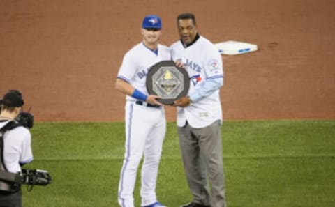 TORONTO, CANADA – APRIL 8: Josh Donaldson #20 of the Toronto Blue Jays is presented with the 2015 A.L. MVP Award by former player and only Blue Jays player to ever win an MVP George Bell before the start of MLB game action against the Boston Red Sox on April 8, 2016 at Rogers Centre in Toronto, Ontario, Canada. (Photo by Tom Szczerbowski/Getty Images)