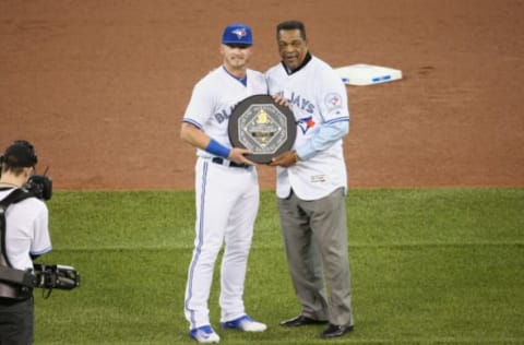 TORONTO, CANADA – APRIL 8: Josh Donaldson #20 of the Toronto Blue Jays is presented with the 2015 A.L. MVP Award by former player and only Blue Jays player to ever win an MVP George Bell before the start of MLB game action against the Boston Red Sox on April 8, 2016 at Rogers Centre in Toronto, Ontario, Canada. (Photo by Tom Szczerbowski/Getty Images)