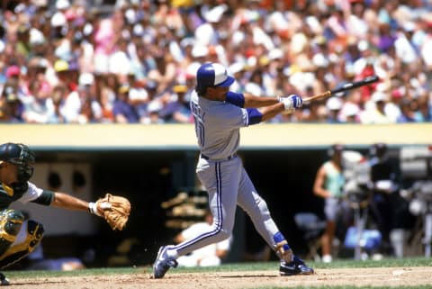 OAKLAND, CA – 1990: George Bell #11 of the Toronto Blue Jays swings at a pitch during a 1990 game against the Oakland Athletics at the Oakland-Alameda Coliseum in Oakland, California. (Photo by Otto Greule Jr/Getty Images)