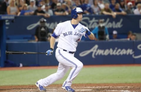 TORONTO, ON – SEPTEMBER 20: Michael Saunders #21 of the Toronto Blue Jays hits a soft grounder as he reaches on an error in the seventh inning during MLB game action against the Kansas City Royals at Rogers Centre on September 20, 2017 in Toronto, Canada. (Photo by Tom Szczerbowski/Getty Images)