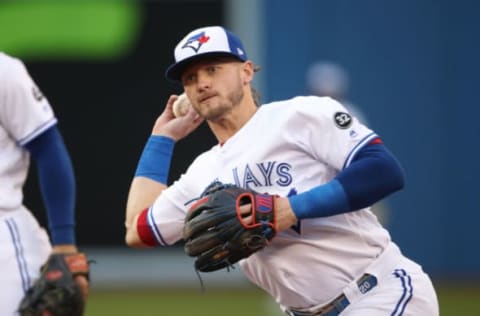 TORONTO, ON – MAY 23: Josh Donaldson #20 of the Toronto Blue Jays makes the play and throws out the baserunner in the third inning during MLB game action against the Los Angeles Angels of Anaheim at Rogers Centre on May 23, 2018 in Toronto, Canada. (Photo by Tom Szczerbowski/Getty Images) *** Local Caption *** Josh Donaldson