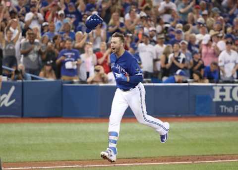 TORONTO, ON – JUNE 30: Justin Smoak #14 of the Toronto Blue Jays celebrates after hitting a game-winning solo home run in the ninth inning during MLB game action against the Detroit Tigers at Rogers Centre on June 30, 2018 in Toronto, Canada. (Photo by Tom Szczerbowski/Getty Images)