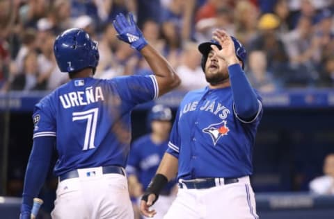 TORONTO, ON – SEPTEMBER 7: Rowdy Tellez #68 of the Toronto Blue Jays is congratulated by Richard Urena #7 after scoring a run on a sacrifice fly in the fifth inning during MLB game action against the Cleveland Indians at Rogers Centre on September 7, 2018 in Toronto, Canada. (Photo by Tom Szczerbowski/Getty Images)