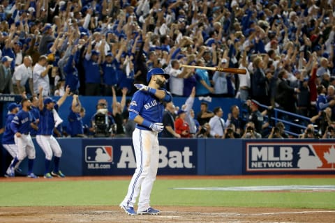 TORONTO, ON – OCTOBER 14: Jose Bautista #19 of the Toronto Blue Jays flips his bat up in the air after he hits a three-run home run in the seventh inning against the Texas Rangers in game five of the American League Division Series at Rogers Centre on October 14, 2015 in Toronto, Canada. (Photo by Tom Szczerbowski/Getty Images)