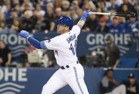 TORONTO, ON – MARCH 30: Justin Smoak #14 of the Toronto Blue Jays hits a double in the first inning during MLB game action against the New York Yankees at Rogers Centre on March 30, 2018 in Toronto, Canada. (Photo by Tom Szczerbowski/Getty Images)