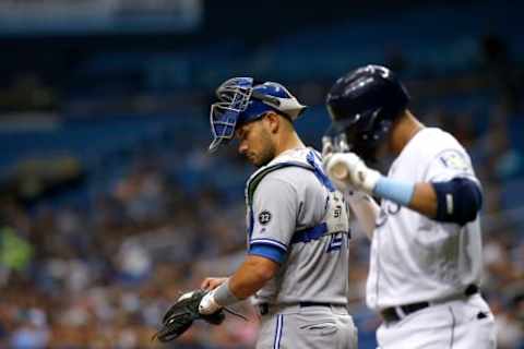 ST. PETERSBURG, FL – JUNE 12: Catcher Luke Maile #21 of the Toronto Blue Jays waits at home plate as Carlos Gomez #27 of the Tampa Bay Rays kisses his bat on his way to face pitcher Jaime Garcia during the second inning of a game on June 12, 2018 at Tropicana Field in St. Petersburg, Florida. (Photo by Brian Blanco/Getty Images)