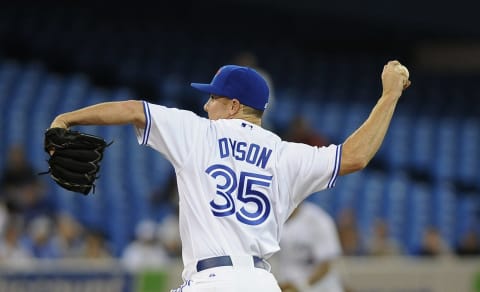 TORONTO, CANADA – JULY 5: Sam Dyson #35 of the Toronto Blue Jays delivers a pitch during MLB game action against the Kansas City Royals July 5, 2012 at Rogers Centre in Toronto, Ontario, Canada. (Photo by Brad White/Getty Images)