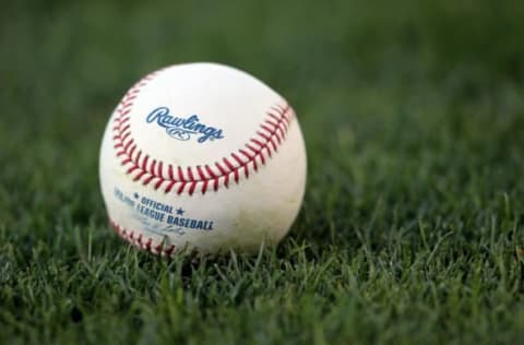 LOS ANGELES, CA – MAY 04: A Major League baseball rests on the grass prior to the start of the game between the Milwaukee Brewers and the Los Angeles Dodgers at Dodger Stadium on May 4, 2010 in Los Angeles, California. (Photo by Jeff Gross/Getty Images)