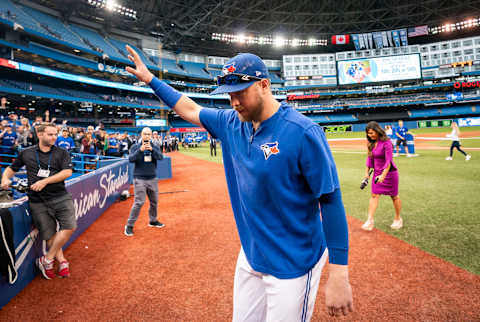 TORONTO, ONTARIO – SEPTEMBER 29: Justin Smoak #14 of the Toronto Blue Jays walks off the field after his team defeated the Tampa Bay Rays in the final game of the season in their MLB game at the Rogers Centre on September 29, 2019 in Toronto, Canada. (Photo by Mark Blinch/Getty Images)