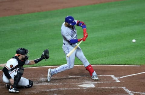 BALTIMORE, MARYLAND – SEPTEMBER 19: Lourdes Gurriel Jr. #13 of the Toronto Blue Jays hits a solo home run against the Baltimore Orioles in the fourth inning at Oriole Park at Camden Yards on September 19, 2019 in Baltimore, Maryland. (Photo by Rob Carr/Getty Images)