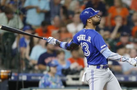 HOUSTON, TEXAS – JUNE 16: Lourdes Gurriel Jr. #13 of the Toronto Blue Jays hits a two run home run in the fifth inning against the Houston Astros at Minute Maid Park on June 16, 2019 in Houston, Texas. (Photo by Bob Levey/Getty Images)