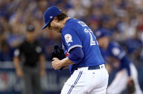 TORONTO, ON – OCTOBER 18: Brett Cecil #27 of the Toronto Blue Jays reacts after closing out the seventh inning against the Cleveland Indians during game four of the American League Championship Series at Rogers Centre on October 18, 2016 in Toronto, Canada. (Photo by Elsa/Getty Images)