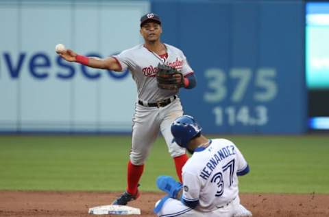 TORONTO, ON – JUNE 15: Wilmer Difo #1 of the Washington Nationals turns a double play in the third inning during MLB game action as Teoscar Hernandez #37 of the Toronto Blue Jays slides into second base at Rogers Centre on June 15, 2018 in Toronto, Canada. (Photo by Tom Szczerbowski/Getty Images)