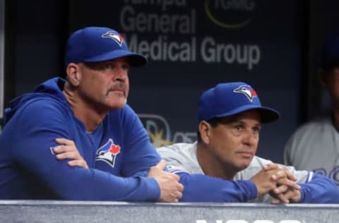 May 28, 2019; St. Petersburg, FL, USA; Toronto Blue Jays manager Charlie Montoyo (right) and pitching coach Pete Walker (left) look on from the dugout during the eighth inning against the Tampa Bay Rays at Tropicana Field. Mandatory Credit: Kim Klement-USA TODAY Sports