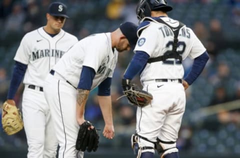 Apr 6, 2021; Seattle, Washington, USA; Seattle Mariners starting pitcher James Paxton (44) reacts following an injury during the second inning against the Chicago White Sox at T-Mobile Park. Mandatory Credit: Joe Nicholson-USA TODAY Sports