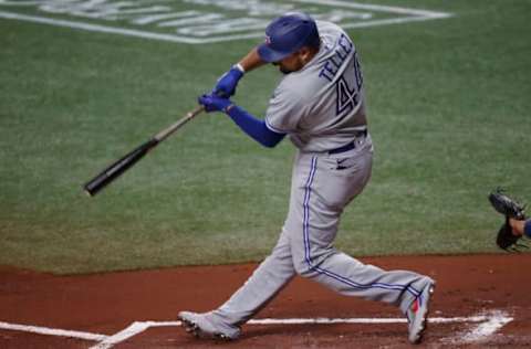 Apr 23, 2021; St. Petersburg, Florida, USA; Toronto Blue Jays first baseman Rowdy Tellez (44) hits an RBI double during the first inning against the Tampa Bay Rays at Tropicana Field. Mandatory Credit: Kim Klement-USA TODAY Sports