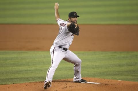 May 6, 2021; Miami, Florida, USA; Arizona Diamondbacks starting pitcher Madison Bumgarner (40) delivers a pitch against the Miami Marlins during the first inning at loanDepot park. Mandatory Credit: Sam Navarro-USA TODAY Sports