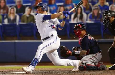 May 20, 2021; Dunedin, Florida, CAN; Toronto Blue Jays catcher Danny Jansen (9) hits a double during the sixth inning agains the Boston Red Sox at TD Ballpark. Mandatory Credit: Nathan Ray Seebeck-USA TODAY Sports