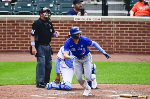 Jun 20, 2021; Baltimore, Maryland, USA; Toronto Blue Jays third baseman Cavan Biggio (8) runs out a two run single in the fourth inning against the Baltimore Orioles at Oriole Park at Camden Yards. Mandatory Credit: Tommy Gilligan-USA TODAY Sports